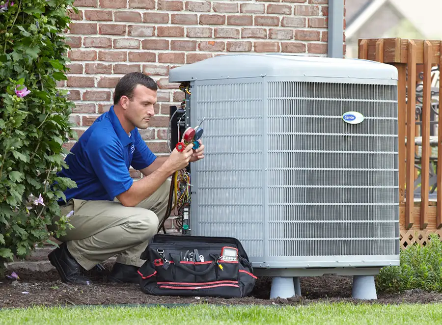 HVAC technician inspecting an outdoor AC unit in Pacifica